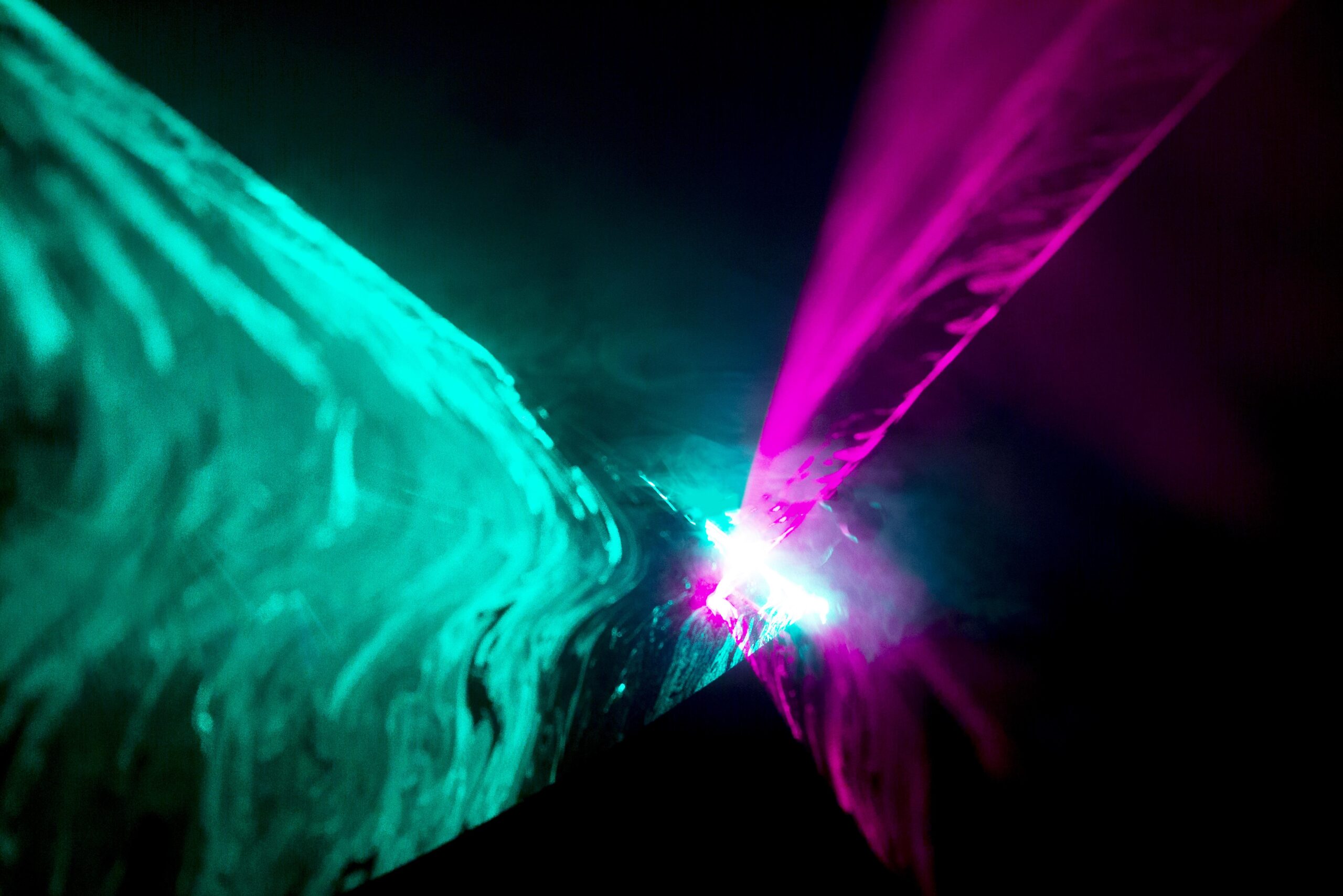 Laser light show beams cutting through haze